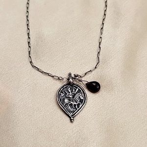 Warrior charm w Garnet. Silver.